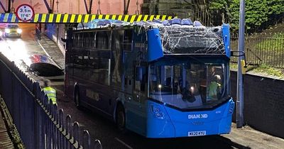 Double-decker bus roof RIPPED off after hitting bridge