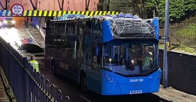 Huge double-decker bus has roof completely ripped off after smashing through a low bridge