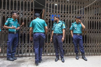 Bangladesh arrests four for caning, stoning woman over affair