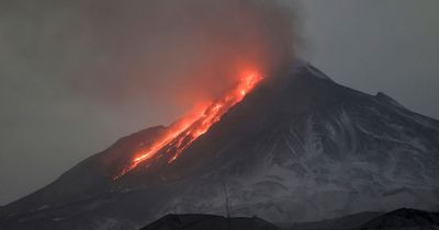 Massive volcanic eruption sends ash cloud 12 miles into sky in apocalyptic scenes