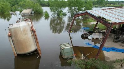 Texas residents wait and watch as a sinkhole in their town grows