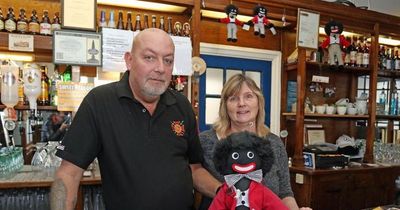 Gollies race row landlady defies police by putting dolls back on display in pub