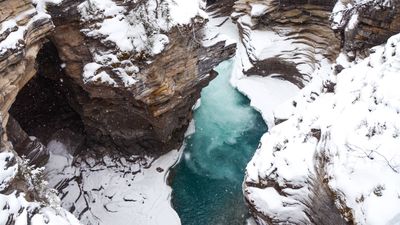 "It's not worth it" – video shows Canadian hiker fall in icy river trying to rescue drone