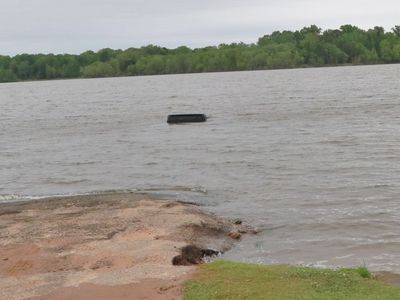 Police came to pull a Jeep out of a lake. They found a woman inside, alive