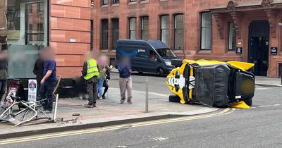 Off-road buggy overturns on busy Glasgow street after smashing into bike railings