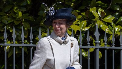 Princess Anne's effortless style strikes again as she pairs chic white coat with interesting navy clutch