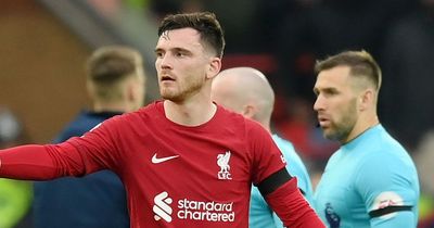 Liverpool's Andy Robertson and assistant ref Constantine Hatzidakis questions asked