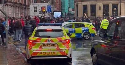 Thousands of chanting Bayern Munich fans march through Manchester ahead of City Champions League tie