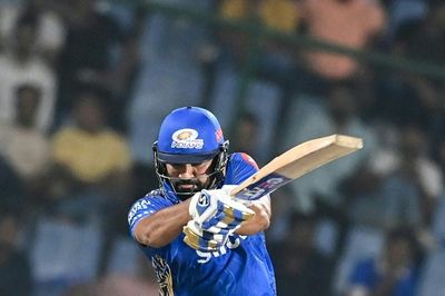 Mumbai win first IPL game in tense chase after Rohit's 65
