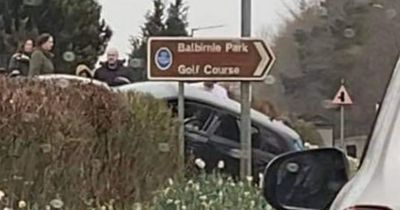 Cops close off Scots road after car crashes into grass verge