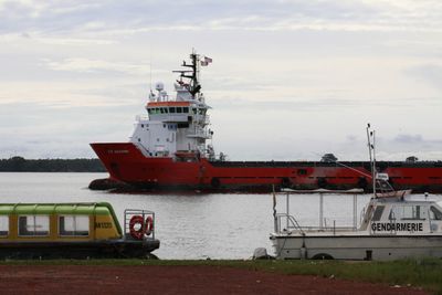 Singapore says unidentified people boarded tanker off Ivory Coast