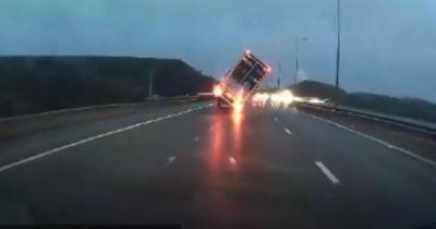 Dramatic moment lorry sent crashing to the ground on M62