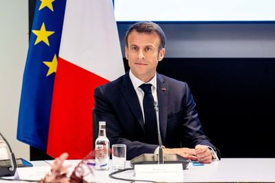Protester runs at Macron during state visit to Netherlands