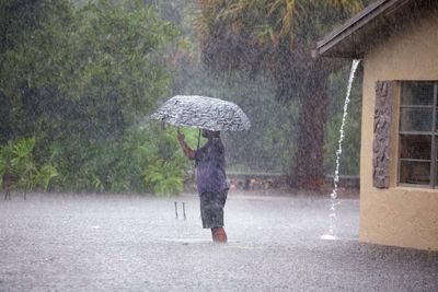 Torrential storms batter South Florida, close key airport