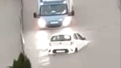 Watch Hatchback Navigate A Flooded Road With Help From Lady Luck