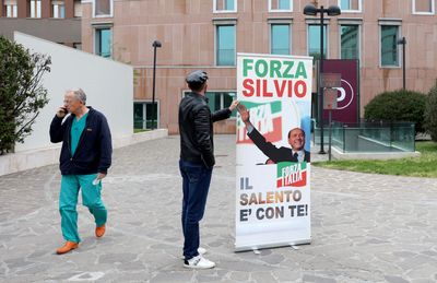 Italy's Berlusconi's health improves, still in intensive care