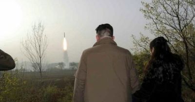Kim Jong Un watches 'most powerful' missile launch with daughter, 10, in chilling images