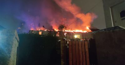 Huge blaze rips through block of Paisley flats as fire crews battle inferno overnight