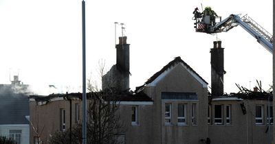 Woman dies in fire at Paisley flat block after building goes up in flames