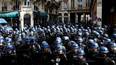 French constitutional court debates pension reform behind police barricades