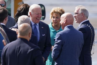 Joe Biden shares laugh with priest as he tours Catholic pilgrimage site