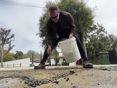 Arnold Schwarzenegger repaired a utility trench, not a pothole, officials say