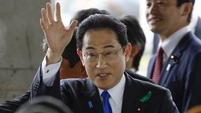 Japanese Prime Minister Fumio Kishida evacuated after man throws suspected smoke bomb