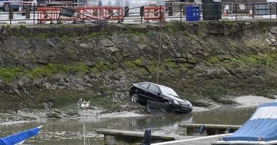 Two rescued after car with L-plates crashes into water from harbour slipway