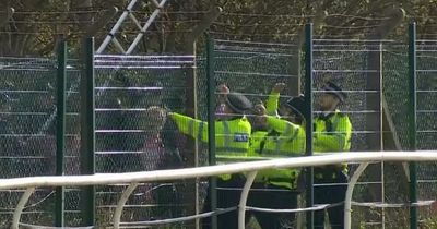 More than 100 arrested after protesters storm Grand National