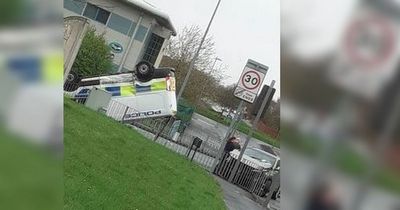 Police van flips on roof after colliding with Kia