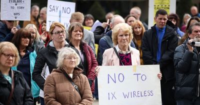 Residents protest against 'cynical' communications firm which has erected hundreds of masts without having to get planning permission