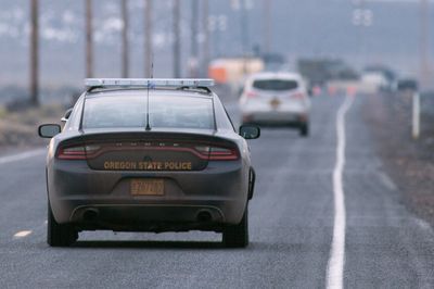 An Oregon man threw money from his car, littering a highway with $100 bills