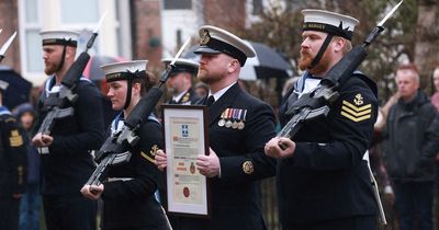 Sailors march in memory of fallen Royal Navy hero