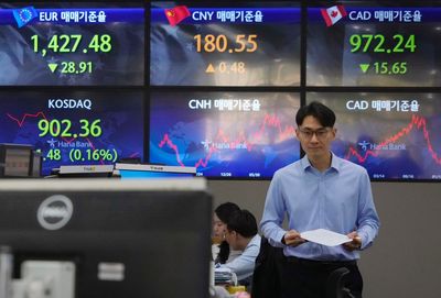 Asian shares mixed over economic growth, rate worries