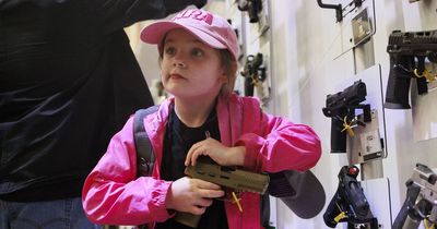 Kids as young as SIX wield guns at bonkers NRA conference with US set for deadliest year