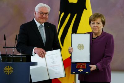 Merkel decorated with highest German honour amid reflection on tenure