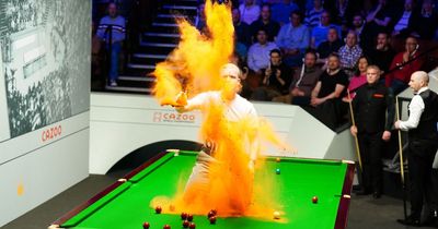 Protesters explain why they covered World Snooker Championship table in orange powder