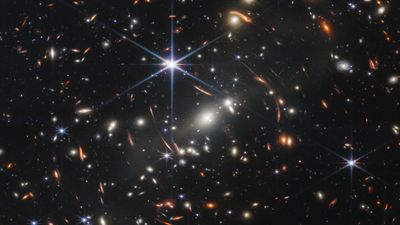Why do some James Webb Space Telescope images show warped and repeated galaxies?