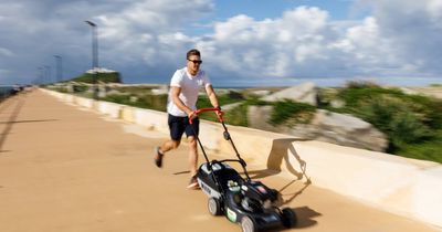 This man ran the entire Newcastle Marathon... pushing a mower