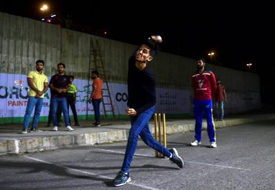 Pakistan street cricket comes to life after dark during Ramadan