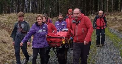 Moffat Mountain Rescue Team stretcher woman from hill