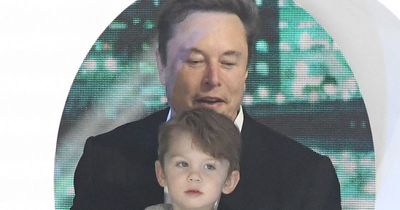 Elon Musk beams with pride as he's joined by rarely seen son, 2, on stage