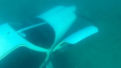 Two people make it to shore after light plane crashes into sea at Leighton Beach, in Perth's south