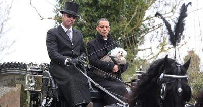 Paul O'Grady's husband rides with coffin on final journey through adoring crowds with family dog