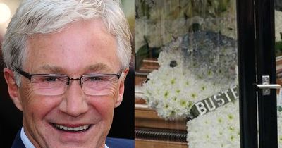Paul O'Grady reunited with beloved dog Buster in emotional floral tribute at funeral