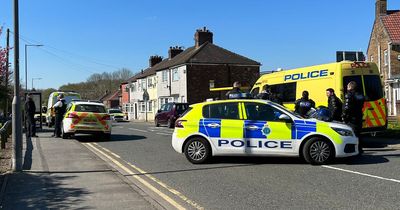 Man in custody after road sealed by police for six hours