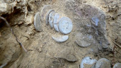 2,000-year-old hoard of Roman coins may have been hidden by a soldier during a bloody civil war in Italy