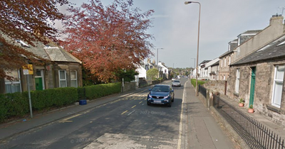 Young Edinburgh man rushed to hospital after street attack as police lock down road