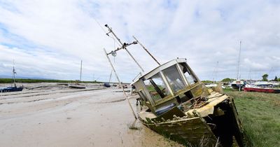 Funding agreed to remove 'dangerous' rotting boats on protected beach