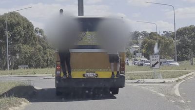 Police warn of dangerous social media trend as footage of children 'bus-surfing' in Canberra emerges